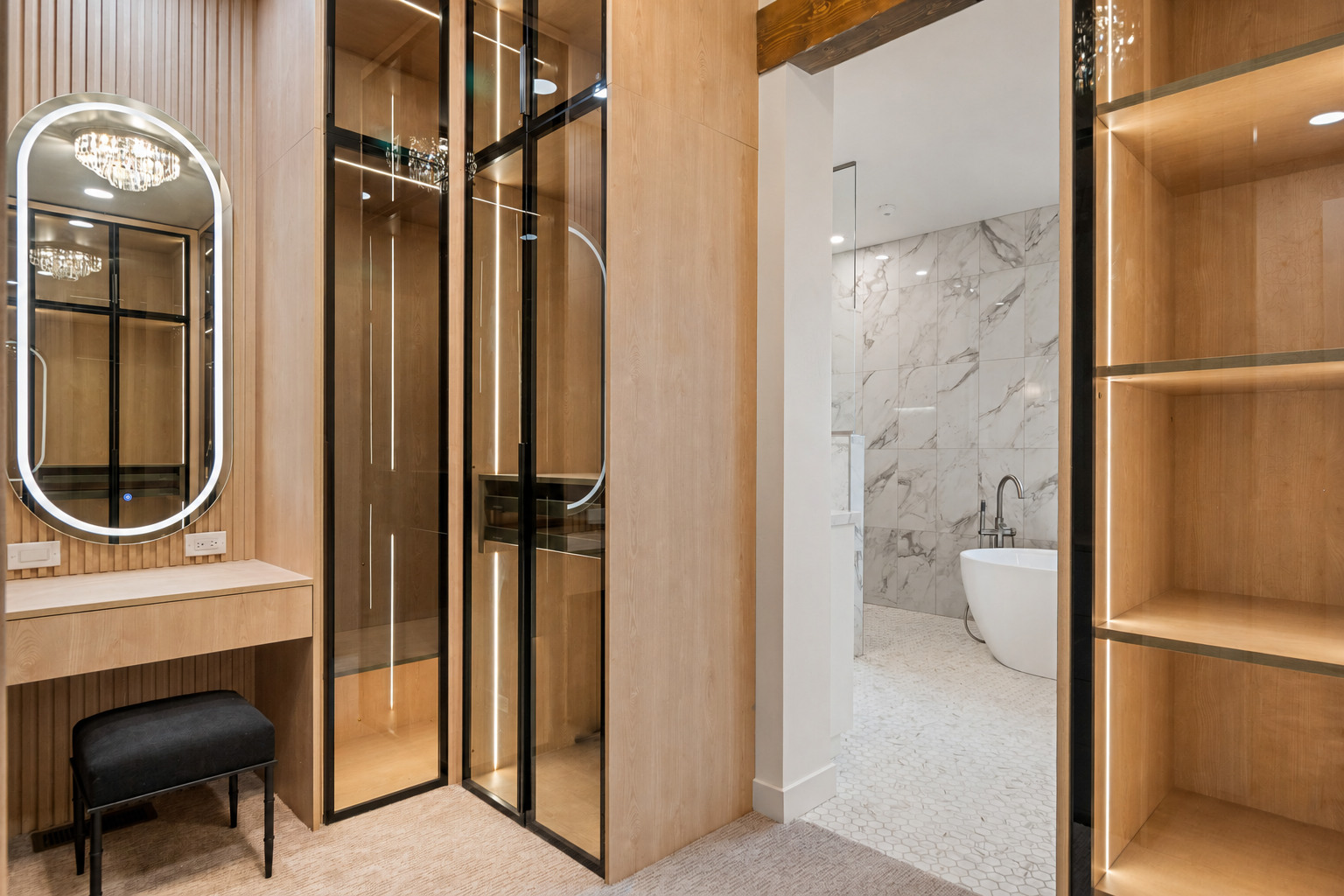 Custom closet designed and supplied by Creative Design Builders leading into a marble bathroom